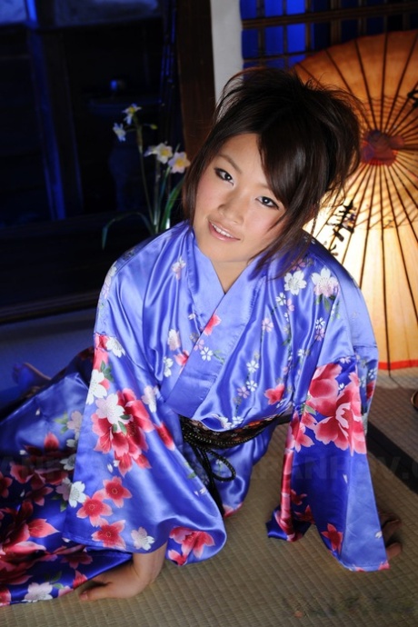 The shoulders of Japanese woman Nene Nagasawa are draped in a classic Kimono gown.
