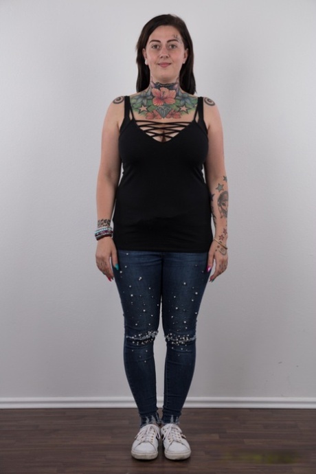 Despite being tattooed, Nikola's overweight body is released from clothing as she works to get out.