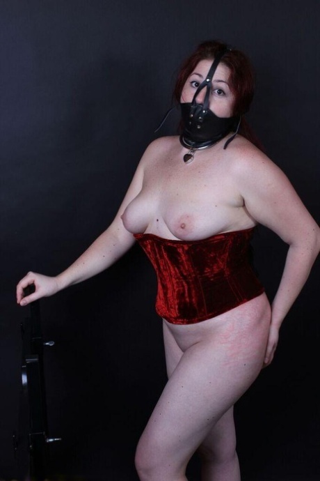 Wearing a gag gag, the redheaded plumper with claws on its nipple has been caught.