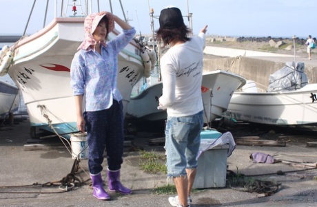 Underwear: A Japanese girl masturbates in her pants, wearing a bonnet and rubber boots.