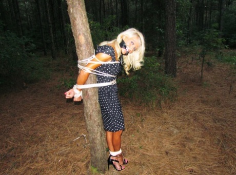 Blonde chick finds herself tied up in various locations in differing outfits