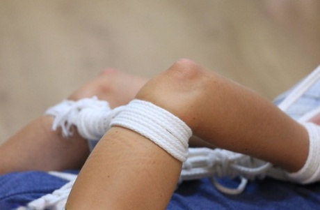 An adjacent female is left with her clothes hogtied and gagged on the floor of the room where she lived.