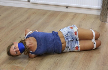 An adjacent female is left with her clothes hogtied and gagged on the floor of the room where she lived.