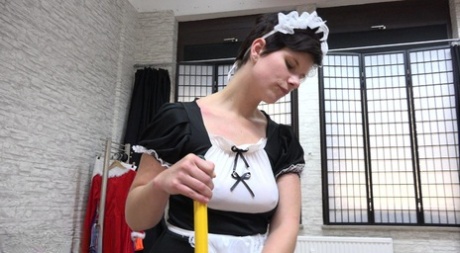 A white maid is subjected to being hogtied and ball gagged while in her uniform.