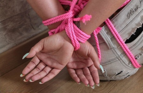 An inked blonde man with a tattoo is seen wearing sexy pantyhose and being tied up while sporting ball gagged.