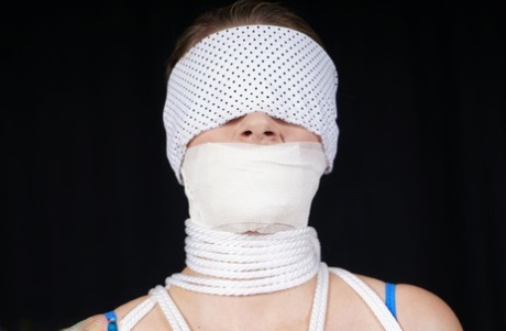 Solo Girl Is Blindfolded And A Gagged While Tied To A Chair In See Thru Attire