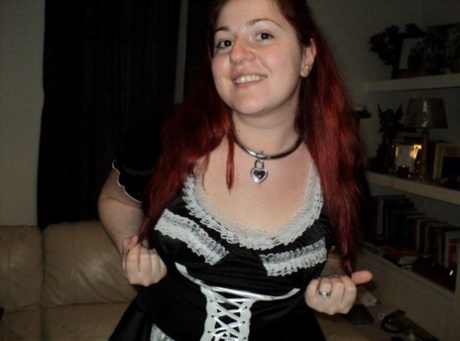 Despite being overweight and having red hair, the blonde maid is being ballgged and handcuffed while at work.