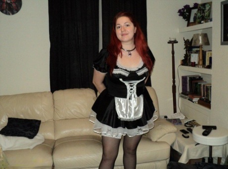 Ball gagged and handcuffed in front of an overweight maid with red hair at work.