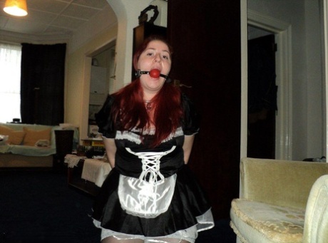 Overweight Maid With Red Hair Finds Herself Ball Gagged And Handcuffed At Work