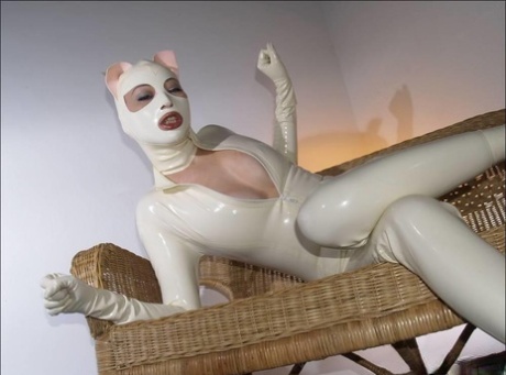 Women wearing rubber clothing model themselves in rubber during a solo engagement.