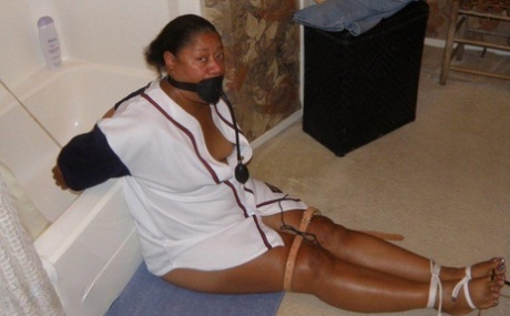 Ebony Plumper Is Silenced With A Pump Up Gag While Restrained In A Bathroom