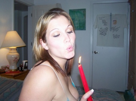 In her anus, Toni, a noisy musician and fan, places a lit candle on the bed.