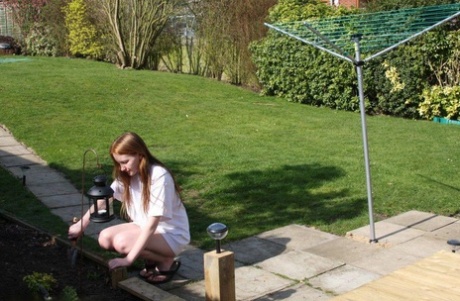 Fair skinned chick is restrained with rope and cages while ball gagged