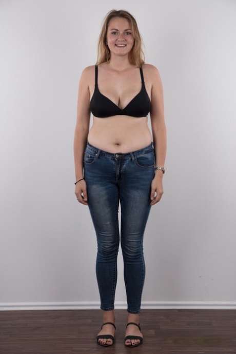 Chubby teen stands fully clothed before doing the same without any clothes on