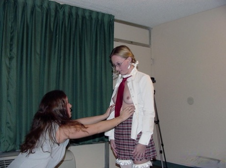 Geeky schoolgirl Candy is brought up in sex by her teacher Chynna, who introduces her to lesbian sex.