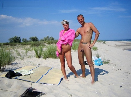 Blonde girl Adele and her boyfriend have sexual intercourse on a deserted sandy beach.