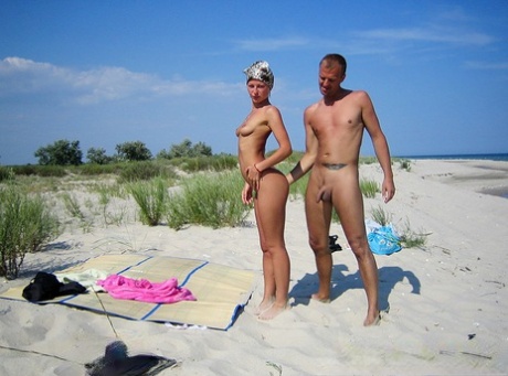 A naked blonde girl and her boyfriend have sex on the deserted sandy beach, with Adele as their partner.