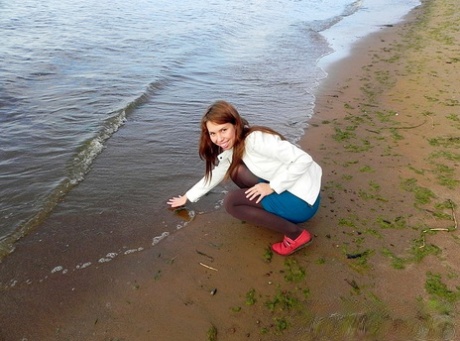 Sex tape is made by homemade before a group of young redhead pees in the beachside car park.