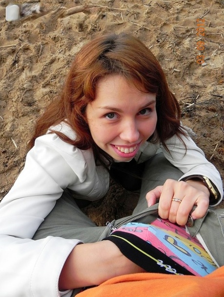 Before making homemade sex tape, young redhead pee in the beach side car park.