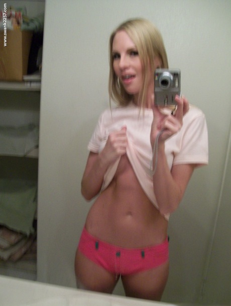 With her busy blonde appearance undressed, Aimee Addison captures mirror selfies.