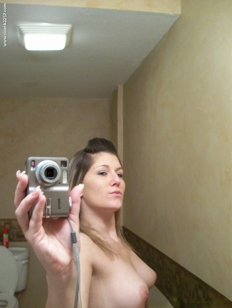 In honor of her bum, an amateur beauty queen takes a few selfies after getting nude shots on her own chest.