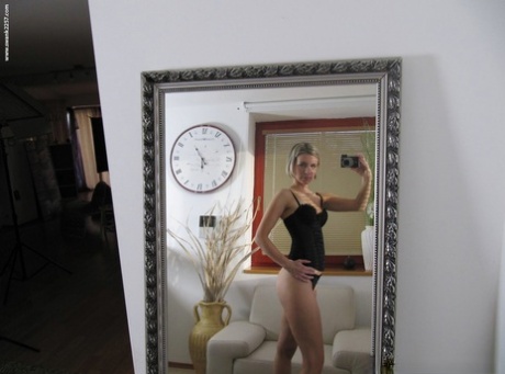 Blonde Amateur Takes Self Shots While Getting Totally Naked Afore A Mirror