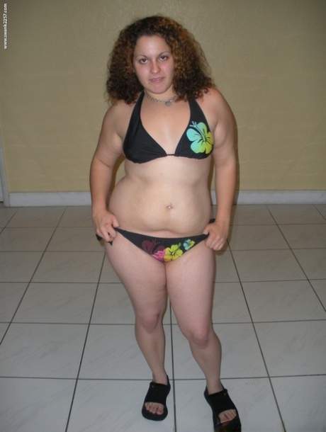 This plump lady has nipple tattoos, plays with her hairless legs, and is now sporting a bikini.