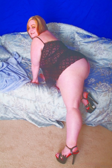 Overweight Redhead Does Away With Her Lingerie Before Holding Her Saggy Boobs