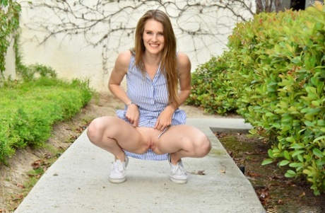 Tits and swings out in the courtyard as an unattractive white amateur exposes her legs.