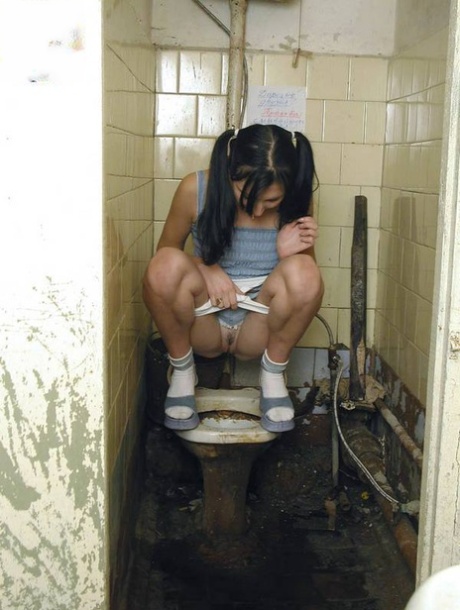 Teen girl in pigtails squats for a pee on the filthiest toilet know to mankind Amateur porn scene picture #9