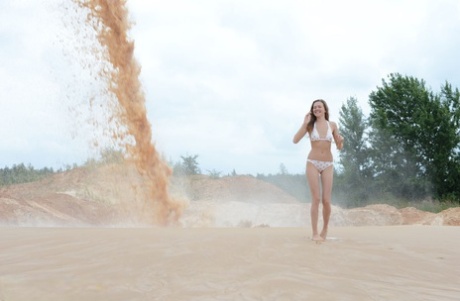 Young Beauty Rumba Gets Totally Naked At A Sand Pit During Operations