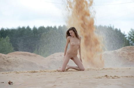 Young Beauty Rumba Gets Totally Naked At A Sand Pit During Operations
