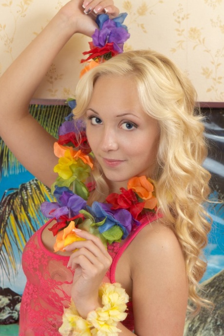 A young blonde girl named Linet is seen getting naked after attending a luau.