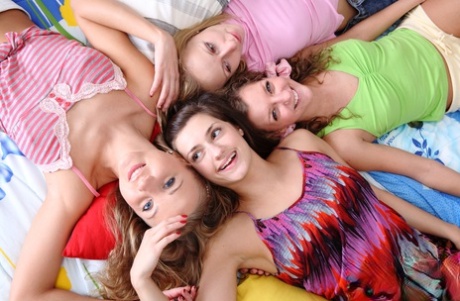Young Girls Gather On A Bed For A Lesbian Foursome After Classes Are Out