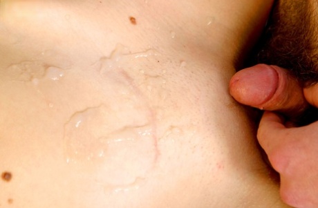 Young girl is disrobed by her boyfriend before they fuck on a bed