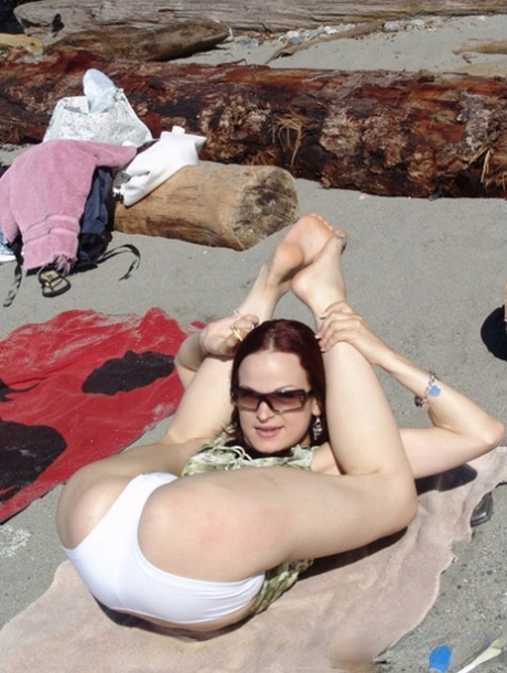 Young Lesbians Show Off Their Flexibility And Thin Bodies At Secluded Beach
