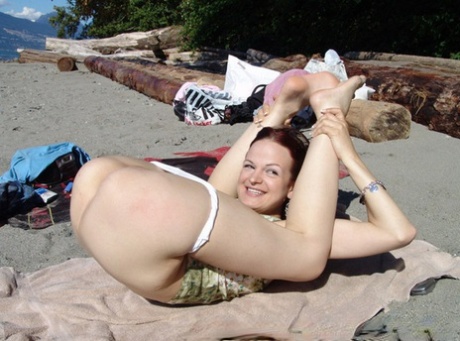 Young Lesbians Show Off Their Flexibility And Thin Bodies At Secluded Beach
