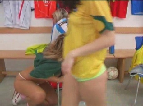 A lesbian threesome is present in the clubhouse amongst some young soccer players.