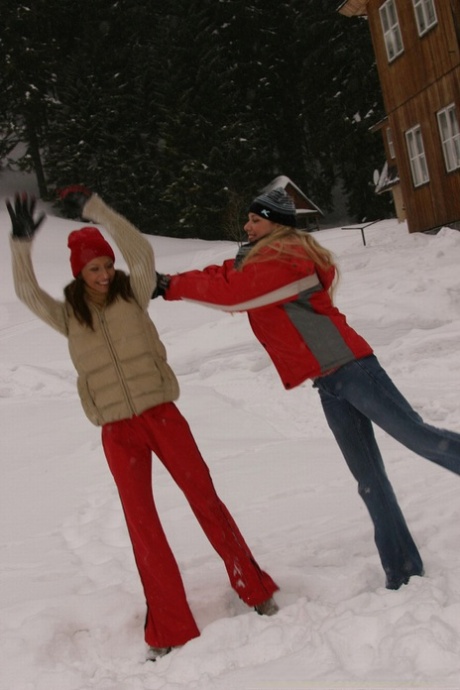 Snow bunnies have outdoor lesbian sex wrapped in a blanket during the winter.