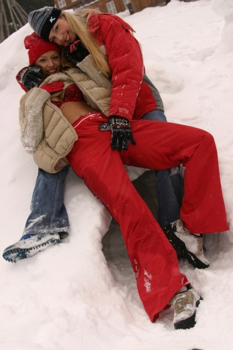 Young snow bunnies have outdoor lesbian sex wrapped in blanket during the winter.