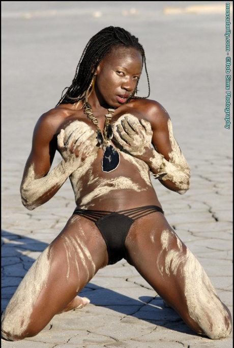 Ebony Bodybuilder Camille Elizabeth Covers Her Toned Body In Beach Sand