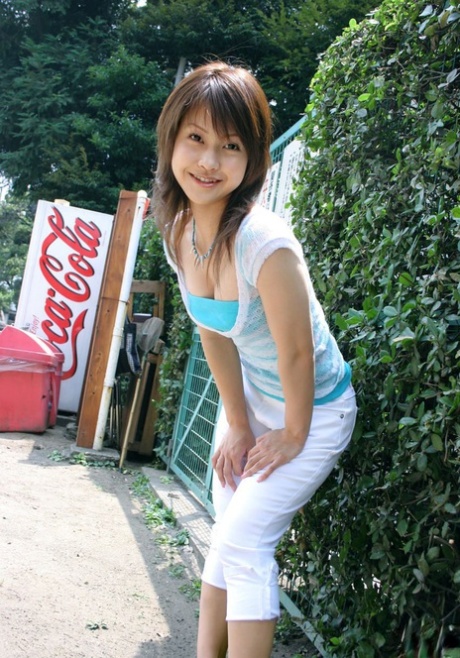 While changing clothes, Ayumi Motomura, a Japanese model, displays her breasts and buttocks.