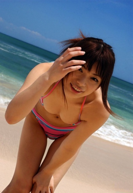 The attractive Asian girl, Hikari Hino, flaunts her genuflect in public places.