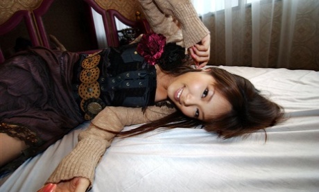 Yua Aida, the seductive Japanese girl, displays her unnatural tits and vagina in solo action.
