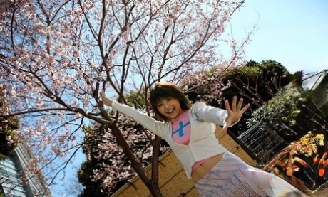 A cute Japanese girl named Azumi Harusaki displays her revealing skirt panties while out in public.