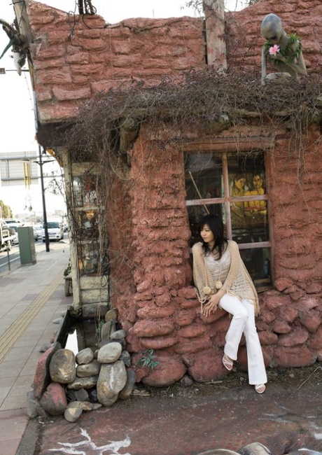 Following her nude appearance on her bed, China Yuki, a beautiful Japanese girl, gets dressed.