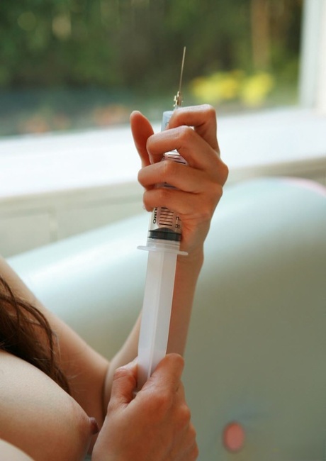 Kinky Japanese Nurse Namie Koshino Pokes Her Naked Body Parts With A Needle