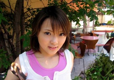 A young Japanese girl squirts her naked body into a bathwater.