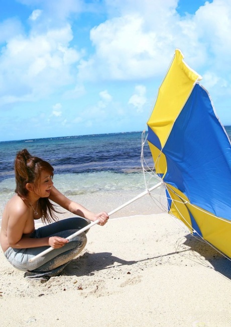 Nao Yoshizaki, a Japanese model from Japan, indulges in a skinny-distance on the beach.