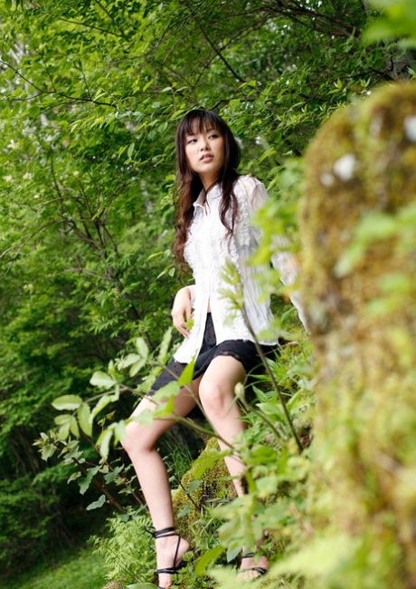 In nature's beauty, Yua Aide, a charming Japanese girl, exposes her firm tits.